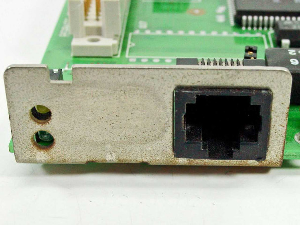 Asante MacLC III Ethernet card — close-up of RJ-45 port bracket showing LED indicators and metal shield with dust and surface wear