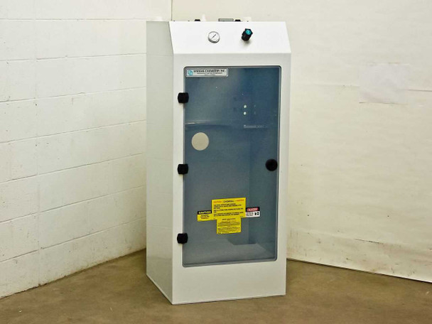 Systems Chemistry Inc. Chemical Tank Delivery System Enclosure – front three-quarter view showing clear door and top-mounted pressure gauge