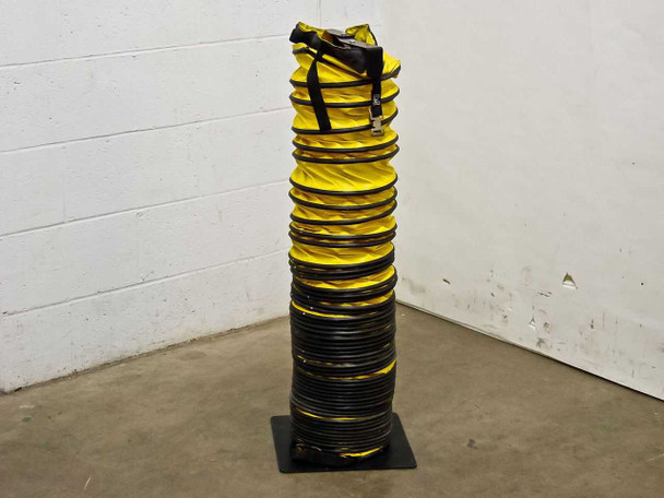 Yellow flexible exhaust duct coiled and stored upright on black metal storage stand, full view showing 15 ft of collapsed ducting