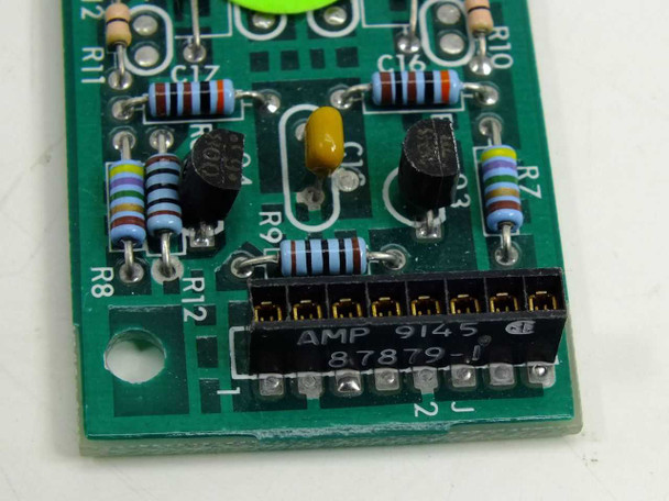 Close-up of Guzik 300100A PCB showing AMP 9145 87879-1 connector, resistors, capacitors, and transistors