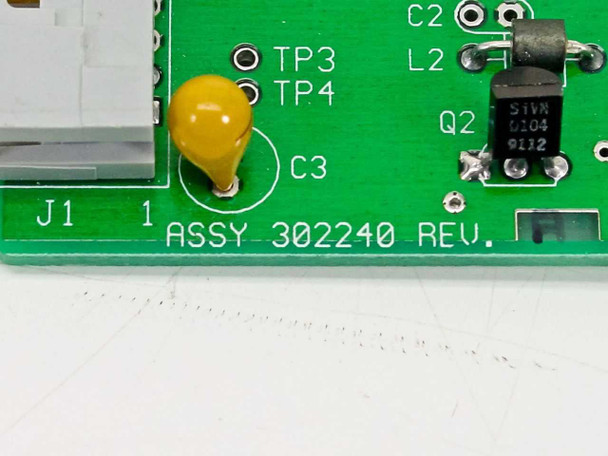 Close-up of Guzik 302240 PCB lower-left corner showing ASSY 302240 REV silkscreen, capacitor C3, test points TP3 and TP4, inductor L2, and transistor Q2 (S1A5 0104)