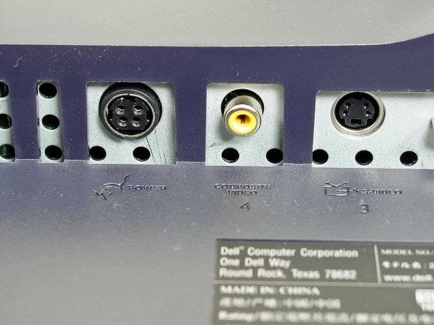 Dell 2001FP rear I/O panel close-up — 4-pin DIN power connector, Composite Video RCA jack (yellow), S-Video 4-pin mini-DIN port