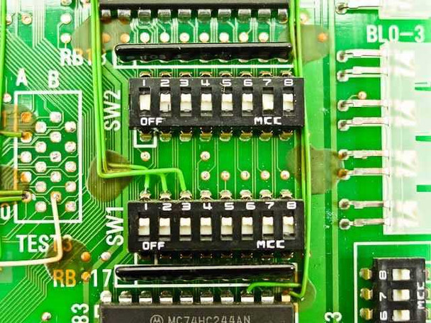 NEC NEC-14T card close-up of SW1 and SW2 8-position DIP switches with OFF/MCC positions, Motorola MC74HC244AN ICs and BLO-3 reference visible