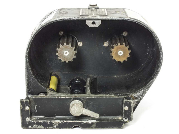 Mitchell 520/3A/300 interior open – two toothed sprocket drive gears, film guide roller, yellow component visible in lower channel, and locking bolt at base