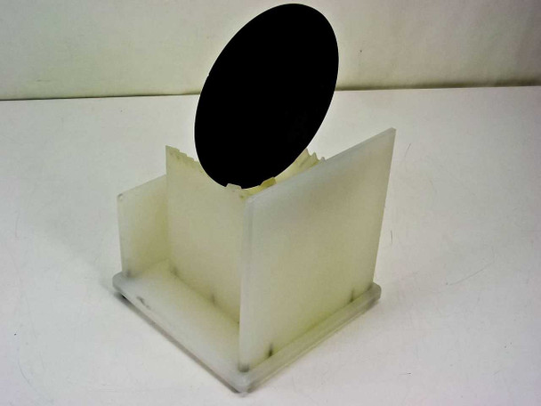 Unbranded 150mm 12-slot wafer carrier holder — second angled front view showing open slot structure and HDPE plastic construction with wafer partially inserted