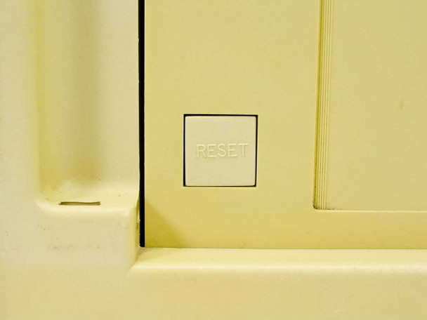 Novell LNalyzer BSI lunchbox computer — close-up of front panel RESET button
