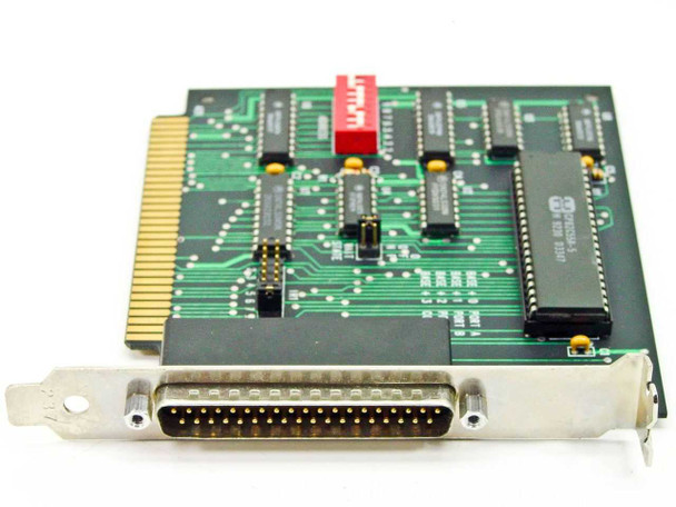 Computer Boards Inc. 8-bit ISA card – angled view showing 36-pin D-sub female bracket connector, red DIP switch bank, and CP82C65A-5 controller chip on component side