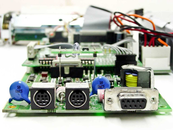 IF5003-02B controller board close-up showing two Mini-DIN connectors and DB9 serial port with blue capacitors