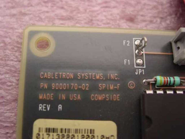 Cabletron Systems SPIM-F2 PCB label showing part number 9000170-02, Made in USA, Rev A, and jumper blocks F1 F2 JP1