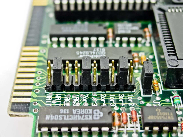 Zoom X5H1-1080K ISA fax modem – close-up of configuration jumper block area with logic ICs including 74LS245 and 74HCT504N