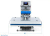 Hotronix® Auto Clam Heat Press 16x20 by Stahls' shown on a print shop table, clamshell open, highlighting its large platen, touchscreen controls, and rugged frame.