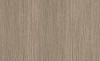 Natural driftwood oak wood grain architectural film with embossed weathered texture. Medium taupe-gray tone perfect for rustic coastal, organic farmhouse, and authentic beach house interiors. Versatile weathered character. 48"×164' roll. 10-year durability.