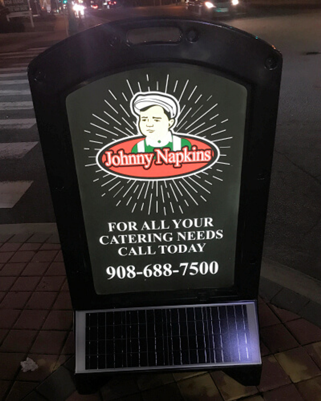 An illuminated image of the Sun Sign's back view, displaying a pizza restaurant's advertisement with their phone number. The bright LED lights ensure the contact information is visible and legible, enhancing customer reach at night.