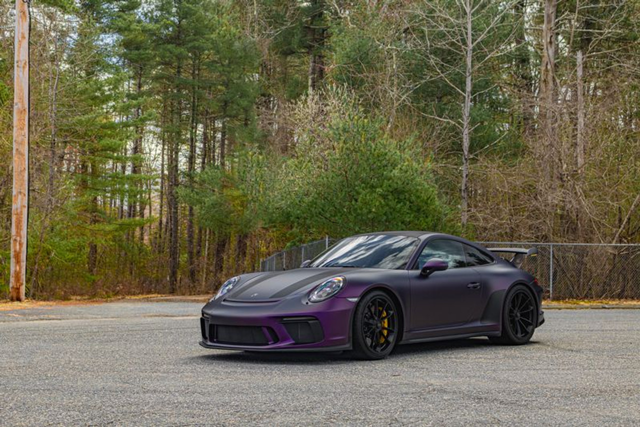 This stunning Lucid EV showcases the futuristic KPMF K75565 Matte Purple Black Iridescent Vinyl wrap, turning heads with its sleek, otherworldly finish. The wrap’s subtle shift from deep purple to black highlights the car's smooth, aerodynamic design, offering a striking contrast that enhances its modern aesthetic. The matte texture complements the electric vehicle's clean lines, providing a bold yet refined look that stands out on the road.