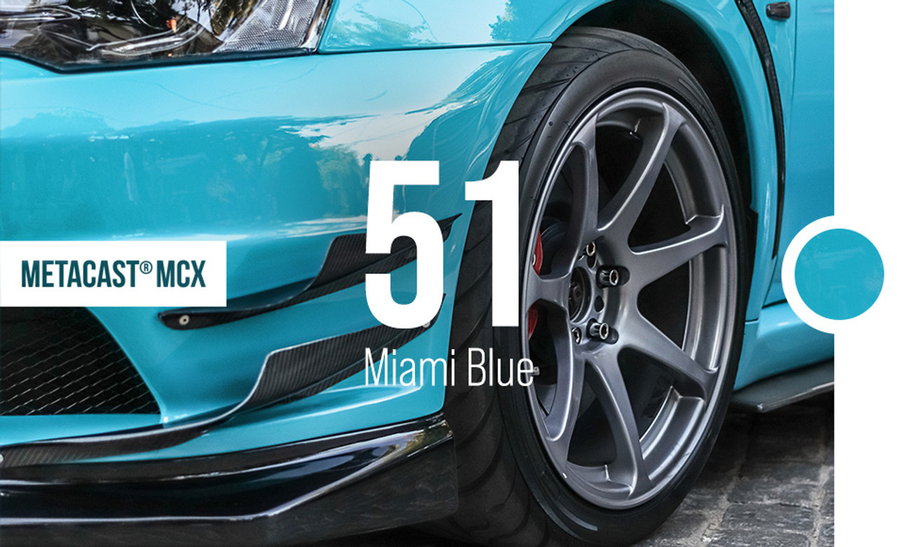A stunning sports car wrapped in Gloss Miami Blue showcases the brilliant, vibrant blue hue with a glossy finish. The color glistens under the light, highlighting the vehicle’s curves and contours with a smooth and sleek appearance. The MetaCast® MCX-51 Gloss Miami Blue wrap adheres seamlessly to the car, providing a flawless and durable finish. This striking color offers a bold, fresh look that stands out on the road, making the vehicle appear both sophisticated and dynamic.