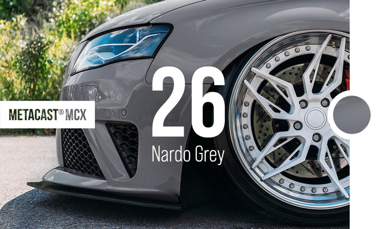 A luxury car wrapped in Gloss Nardo Grey showcases the sleek and modern look of this high-performance color. The deep grey hue, combined with the glossy finish, enhances the car’s refined lines and curves. The MetaCast® MCX-26 Gloss Nardo Grey wrap adheres perfectly to the vehicle’s contours, providing a seamless, high-gloss finish. The color's understated sophistication makes the car look elegant and dynamic, a perfect choice for those seeking a timeless and premium vehicle wrap.
