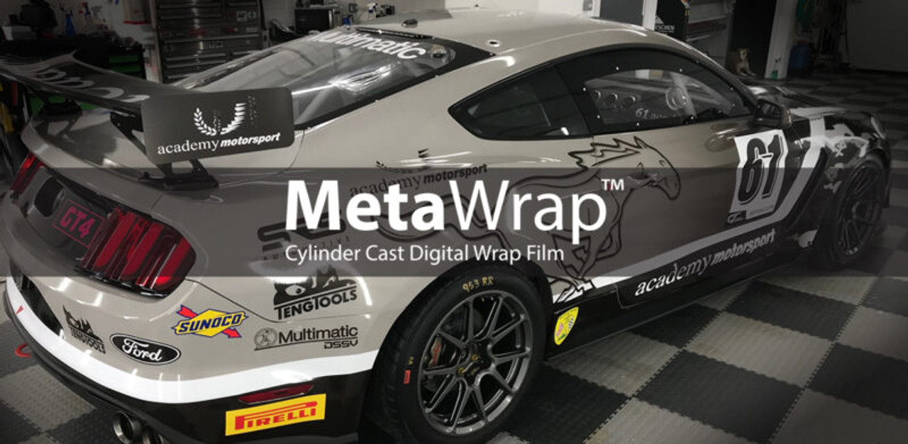 A Ford Mustang being wrapped with vibrant, high-quality vinyl film. The vehicle is undergoing a transformation with a sleek, glossy finish that highlights its bold curves and aerodynamic design. The wrap is being carefully applied to the body of the car, showcasing the precision and skill needed for a flawless application over the Mustang’s curves, vents, and contours. The graphic design features sharp, striking lines, and the vibrant color contrasts beautifully against the car’s original paint, giving it a fresh, eye-catching look.
