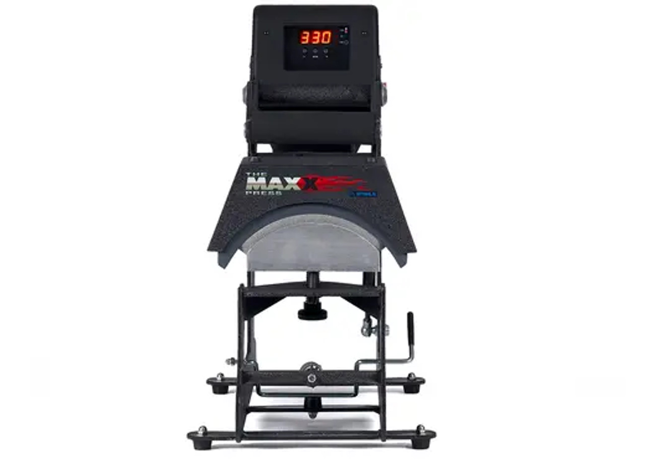 The MAXX® Cap Heat Press by Stahls' shown on a worktable with curved lower platen and digital controls—ideal for customizing hats and caps with ease.