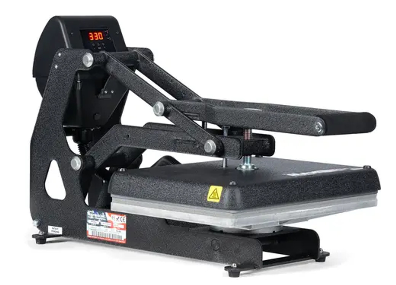 The MAXX® Clam Heat Press 11x15 by Stahls' sitting on a worktable with clamshell open, showing the compact platen, digital control panel, and durable steel frame.