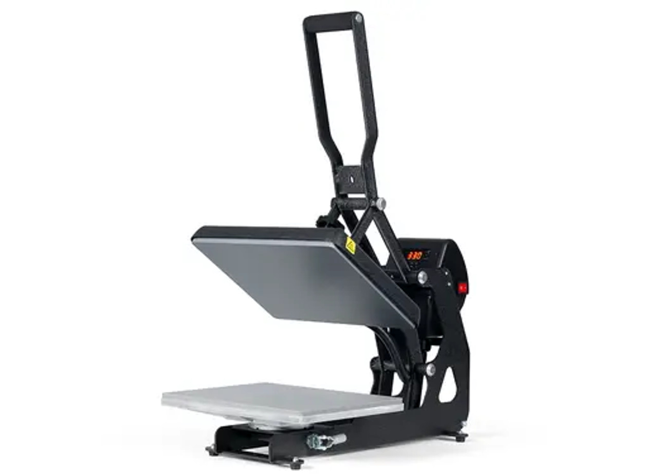 The MAXX® Clam Heat Press 11x15 by Stahls' sitting on a worktable with clamshell open, showing the compact platen, digital control panel, and durable steel frame.