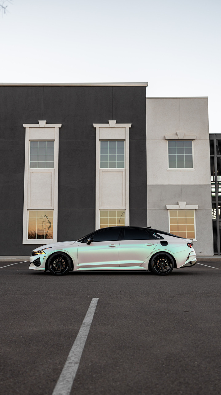 A Lexus sedan wrapped in KPMF Matte Aurora Pearl vinyl, showcasing a soft satin matte surface with iridescent pearl undertones that subtly shift under natural light, delivering a high-end, elegant finish.