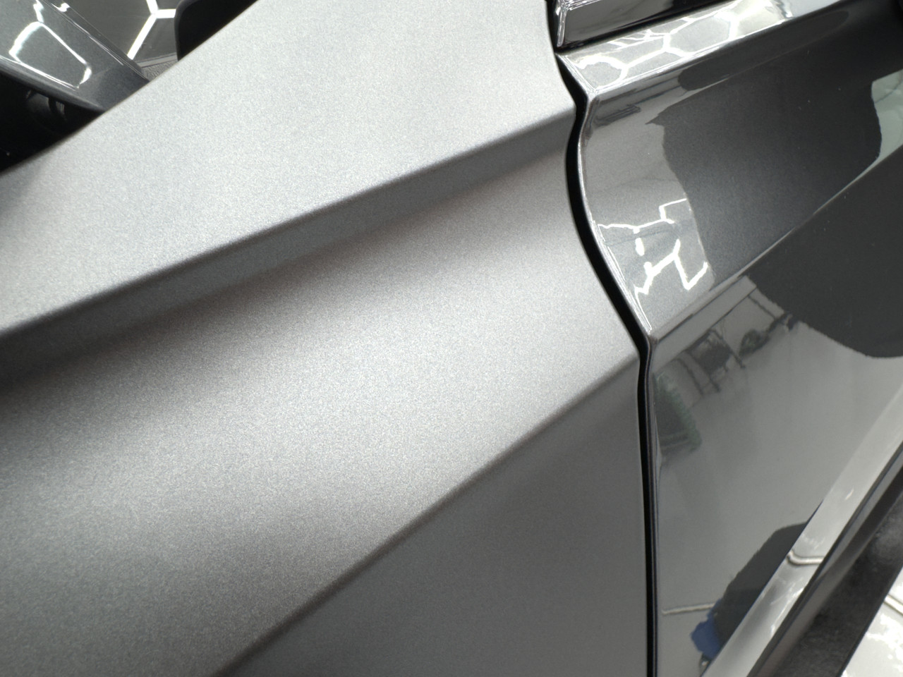 Roll of ORAGUARD® 2815MF+ Paint Protection Film unboxed, showing the satin-matte texture and high-quality construction.