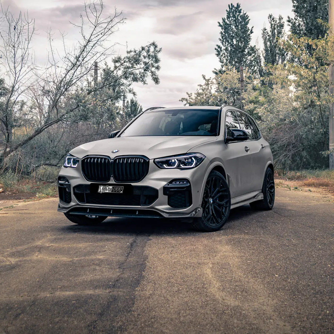 Gloss Grey Matter applied to a vehicle quarter panel, showcasing the high-gloss light grey sheen under natural light.