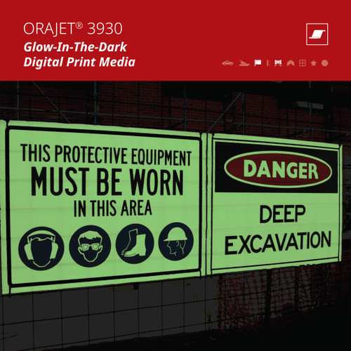 A construction site safety sign illuminated at night, warning workers and pedestrians of deep excavation. The sign is glowing with ORAJET® 3930 Photoluminescent Film, ensuring visibility even in low-light conditions, enhancing safety after dark.