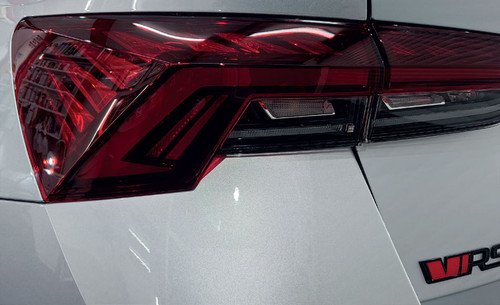 Rear of the Car with Metamark M-PPF® RS Paint Protection Film: "View of the rear of a car featuring Metamark M-PPF® RS Paint Protection Film. The high gloss, clear film offers invisible protection, safeguarding the car's paint from contaminants, abrasion, and UV damage. With self-healing properties, the film ensures long-lasting, near-invisible protection against scratches and minor abrasions.