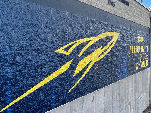 DPF V9500 applied to a textured brick wall with vibrant print graphics and seamless edge conformability.