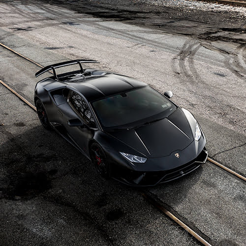 Satin Wrap Rod PPF applied to a performance car hood and fender, showing a low-sheen stealth finish under ambient lighting.