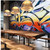 Wall Wrap Using DryTac ReTac Textures
A modern living room with a stunning wall wrap created using DryTac ReTac Textures material. The wall displays an elegant mural with a subtle canvas texture, adding depth and dimension to the space. The wrap adheres seamlessly to the wall, showcasing the material’s ability to create eye-catching, professional-grade graphics with easy repositioning. This photo highlights the versatility and aesthetic appeal of the ReTac Textures film in a home environment.
