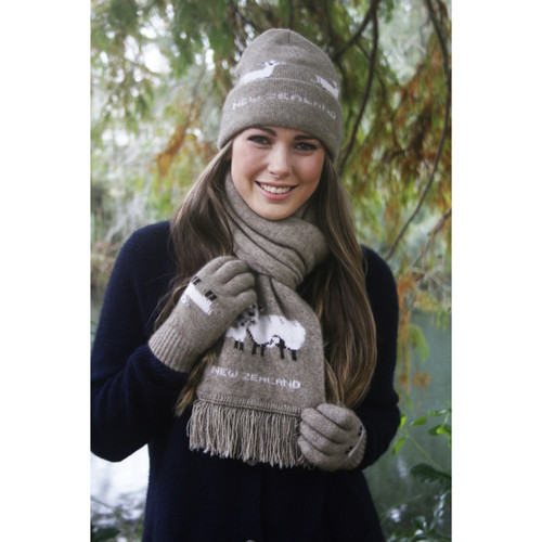 Woman wearing scarf with sheep detailing Woman wearing scarf with sheep detailing