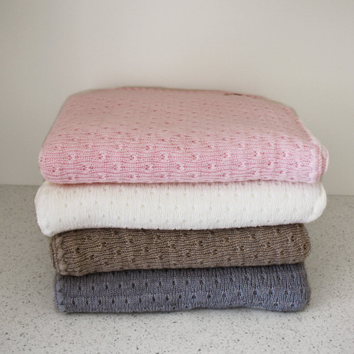 Stack of different coloured baby blankets. Stack of different coloured baby blankets.