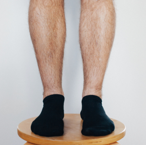 Man wearing sneaker socks in Black Man wearing sneaker socks in Black