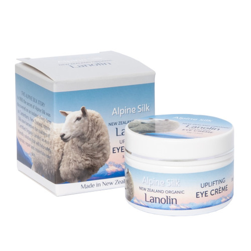 White 30gr pot of eye creme. Next to blue and white box packaging.   White 30gr pot of eye creme. Next to blue and white box packaging.