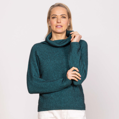 Woman wearing Noble Wilde - Merino & Possum Moss Switch Cowl Jumper (NW3126) in the colour Paua. Woman wearing Noble Wilde - Merino & Possum Moss Switch Cowl Jumper (NW3126) in the colour Paua.