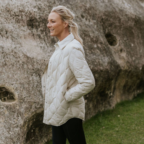 Woman wearing Moke - Ash Down Overshirt in the colour Cream.