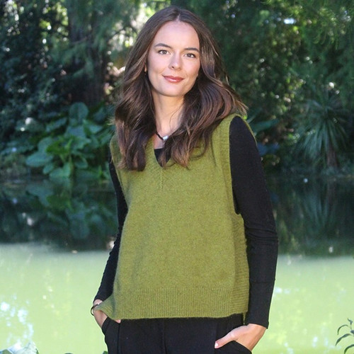 Woman wearing the Lothlorian - Merino & Possum Ride Vest (9650) in the colour Olive. 