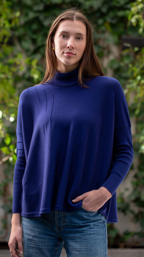 Woman wearing Country Laine - High Neck Sway Jumper (CL0122-IND2026) in the colour Atlantic.