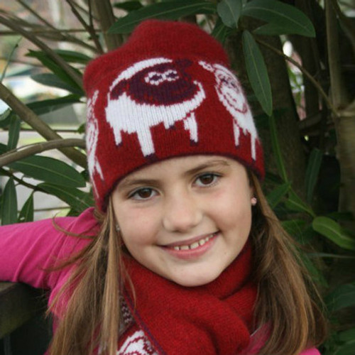 Girl wearing Beanie in colour red. Girl wearing Beanie in colour red.
