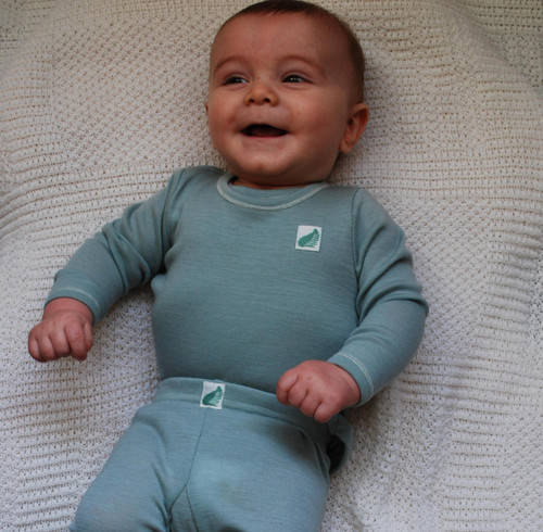 Merino wool long sleeved babies top in teal. Merino wool long sleeved babies top in teal.