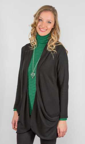 Woman smiling wearing long line jacket. Colour Black