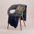 McDonald - Merino & Possum Ombre Throw (5020)-Navy/Pewter/Mocha colour throw on chair