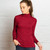 Woman wearing polo neck in colour Portobello Woman wearing polo neck in colour Portobello