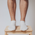 Front view of man wearing sneaker socks in white. 