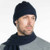 A man wearing an Navy-coloured Koru Merino and Possum Plain Beanie.