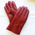 A pair of red coloured Four Peaks hand stitched women’s lambskin gloves.
