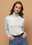 Woman wearing Bay Road Merino - Isabel Polo (BR716) in the colour Winter White