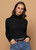 Woman wearing Bay Road Merino - Isabel Polo (BR716) in the colour Black